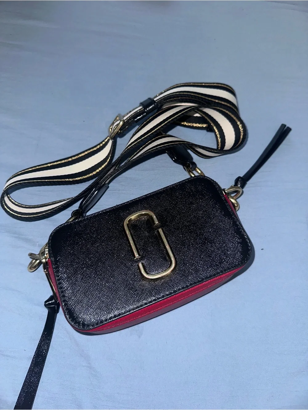 Marc Jacob’s Black and Red Crossbody Camera Bag with Gold Hardware